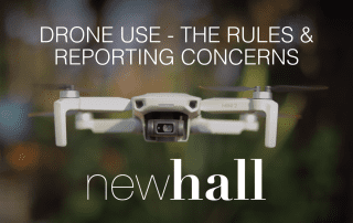 A drone flying in a wooder areas.