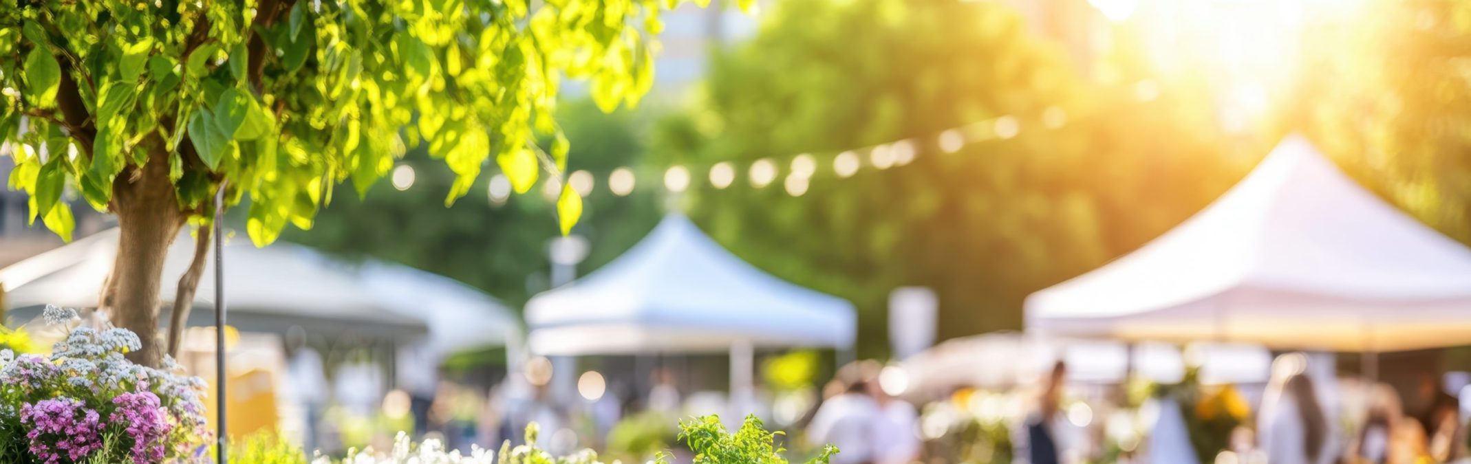 Vibrant Market Day: A cheerful and bustling outdoor market scene with vibrant flowers and plants in the foreground.
