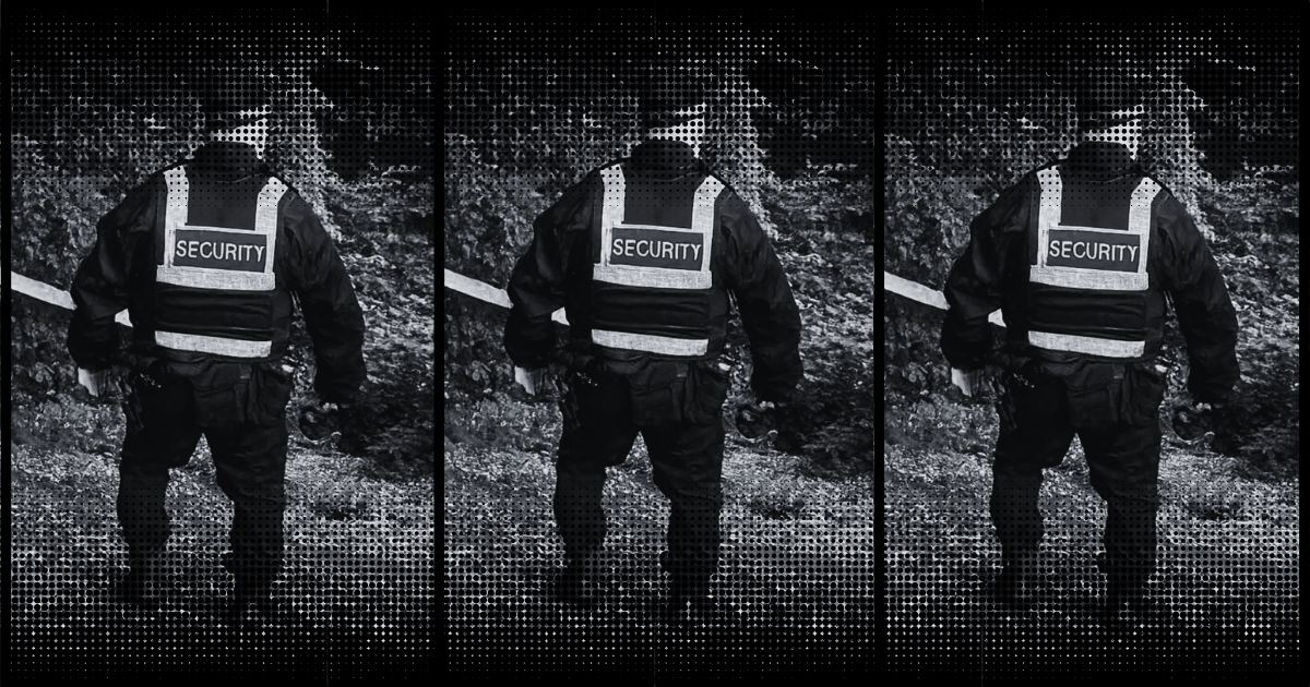 Black and white image of a security guard in woodland in Newhall.